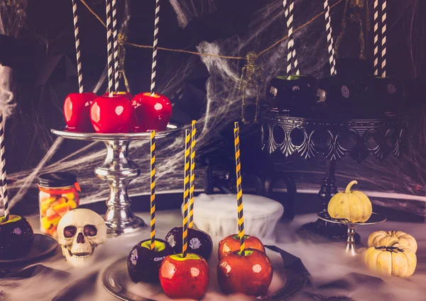 Table with colored candy apples — Stock Photo, Image