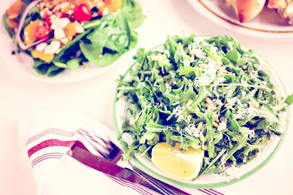 Arugula salad with pine nuts — Stock Photo, Image