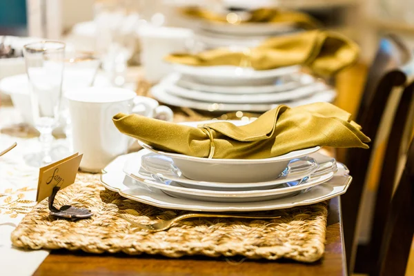 Table set with plates and silverware — Stock Photo, Image