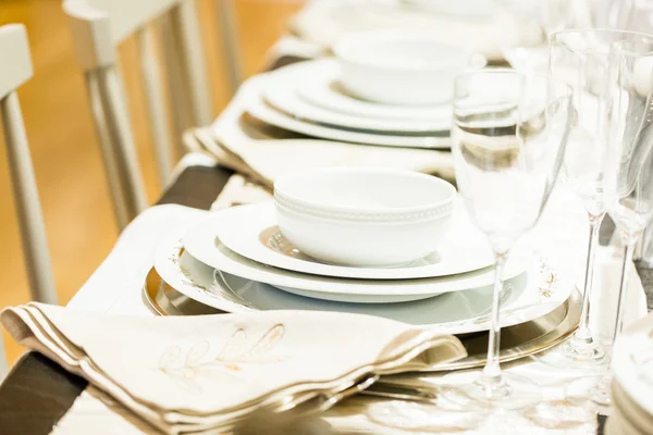 Table set with plates and silverware — Stock Photo, Image