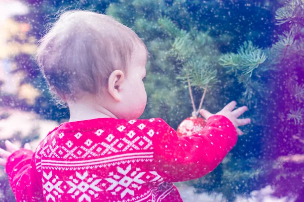 Baby girl in red Scandinavian dress — Stock Photo, Image