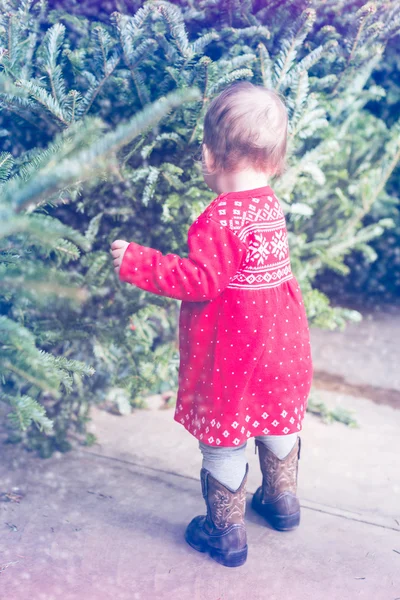 Baby girl in red Scandinavian dress — Stock Photo, Image