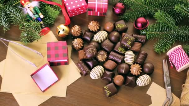 Wrapping assorted chocolates in small boxes — Stock Video