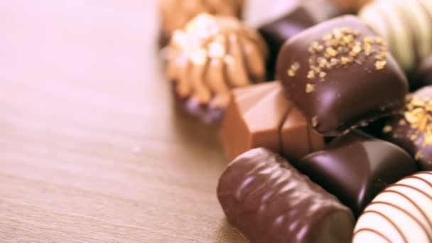 Doces de chocolate em diferentes formas — Vídeo de Stock