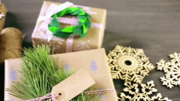 Christmas gifts wrapped in brown paper — Stock Video