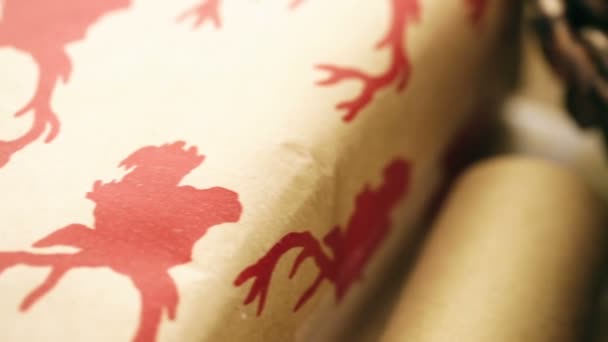 Christmas gifts wrapped in brown paper — Stock Video