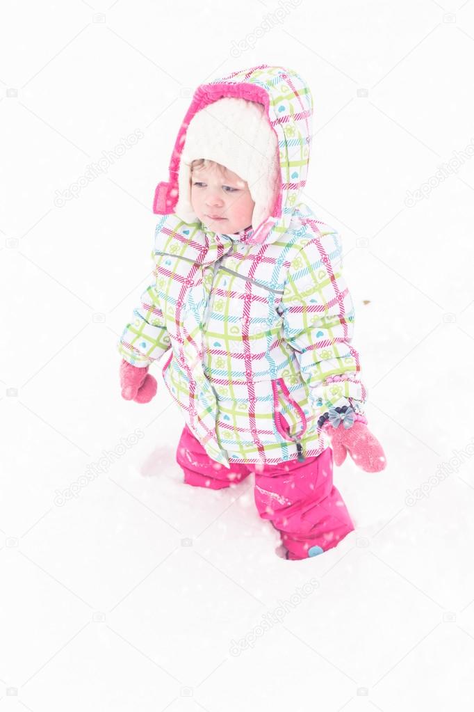girl playing in fresh snow