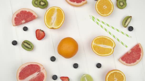 Citrus fruits heart vitamin C on white wooden background. — Stock Video