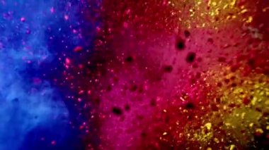 Mavi, kırmızı ve sarı toz rengi. siyah arkaplan