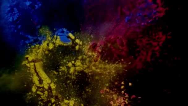 Colore scoppio di polvere blu, rossa e gialla. sfondo nero — Video Stock