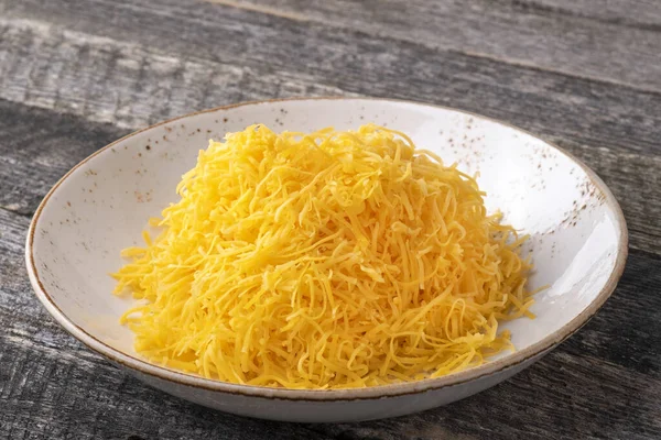 Grated Yellow Cheese Plate — Stock Photo, Image