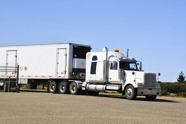A truck carrying all three stages of the Orbital Sciences Pegasus XL rocket arrives at Vandenberg Air Force Base in California. background template , elements of this image furnished by nasa
