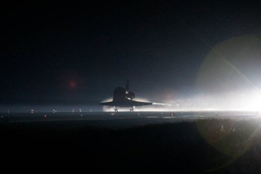 Atlantis nears touchdown for the final time on Runway 15 at the Shuttle Landing Facility at NASA kennedy Space Center in Florida, 21 July 2011.background template , elements of this image furnished by nasa clipart