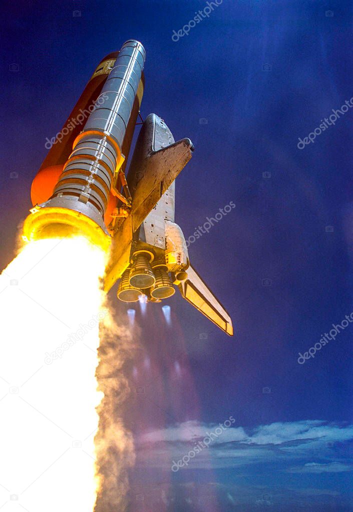 Making history with the first-ever launch on Independence Day, Space Shuttle Discovery rockets into the blue sky on mission STS-121, background template , elements of this image furnished by nasa