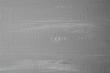 Yumuşak açık gri yüzey, modern tasarımın tipik ince bir dokusu ve deseni gösterir..