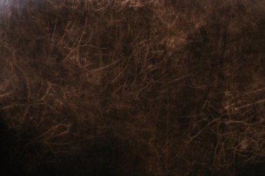 Eskimiş malzeme arka planı ve tasarım ayrıntıları için kahverengi sıkıntılı deri dokunun yakınlaştırılması 