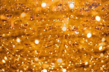 Karmaşık dokuma desenli soyut altın ışık bokeh arkaplan