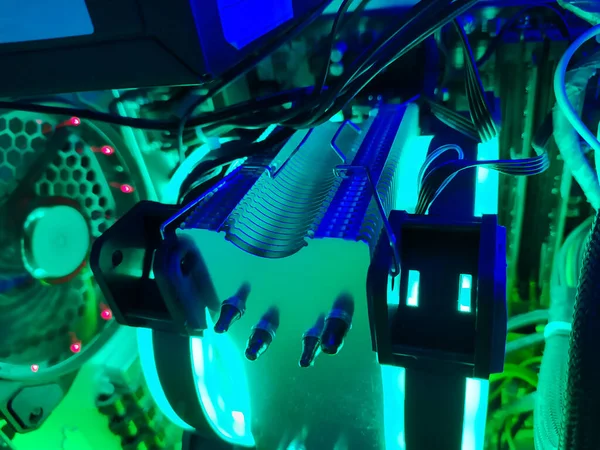 Modern computer air cooling with multi-colored led backlight-fans, cooling radiators, cables, boards, close-up.