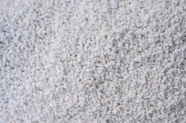 Perlite dokusu ve arka planının tam kare görüntüsü. Havalandırma ve drenajı artırır, bu da kök çürümesini önler ve güçlü kök büyümesini teşvik eder..