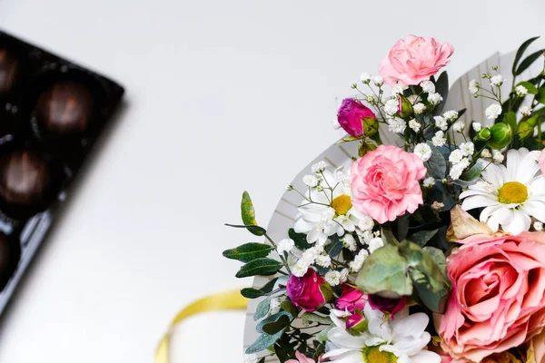 Flowers and chocolate. Flowers, bridal bouquet close-up. Decoration of roses, peonies and ornamental plants, close-up, nobody, objects. Gift for Valentines day Women day. Mothers Day. selective focus