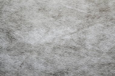 Defocus grey spunbond dokumasız jeotextile yakın çekim makro. Kapatın. Küçük noktalar. Kirli doku. Tasarım, arkaplan, fon. Odaklanamıyorum.
