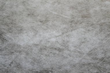 Defocus grey spunbond dokumasız jeotextile yakın çekim makro. Küçük noktalar. Kirli doku. Tasarım, arkaplan, fon. Odaklanamıyorum.