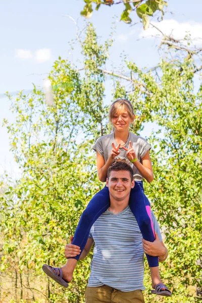 Defocused Brother Giving Sister Ride Back Portrait Happy Girl Man — Stock Photo, Image