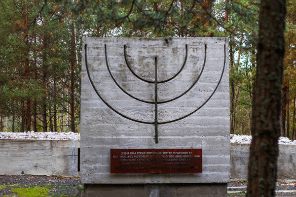 Konyshche, Ukraine - 22.10.2020: concrete memory monument of jew, dedicated to jewish people executed in 1941-1944 years near Ratno by German forces. War and nazism, tragedy. Holocaust. Out of focus.