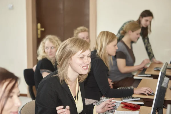 Female students in classroom — Stock Photo, Image