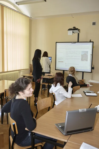 Female students in classroom — Stock Photo, Image