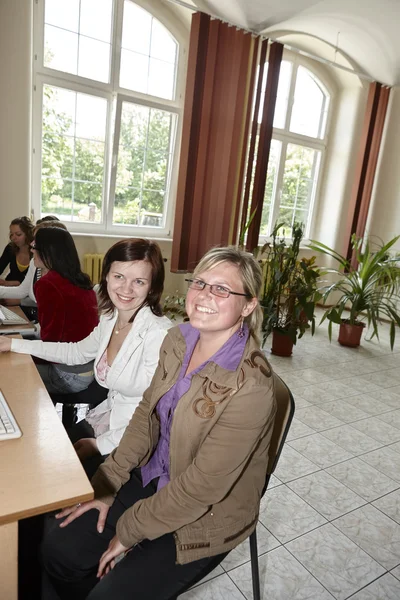 Female students in classroom — Stock Photo, Image