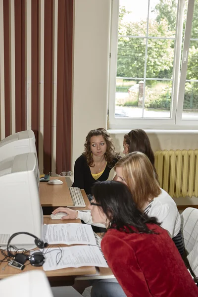 Female students in classroom — Stock Photo, Image