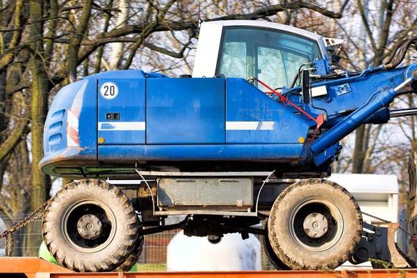 Digger-loader on a trailer — Stock Photo, Image