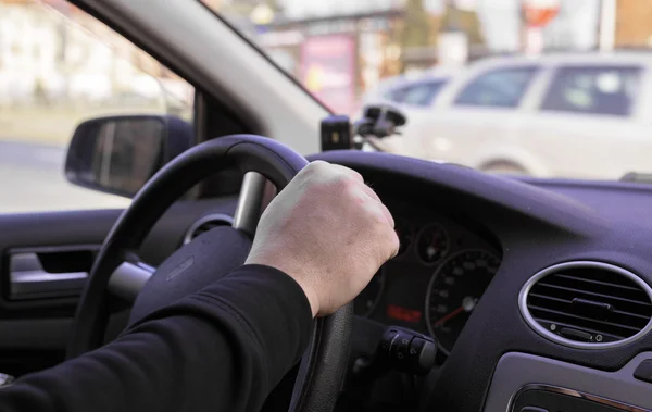 Drivers hand on wheel — Stock Photo, Image