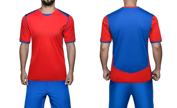 Jugador de fútbol en uniforme deportivo camisa azul-roja y pantalones cortos sobre fondo blanco aislado. Mockup fútbol uniforme vista frontal y trasera —  Fotos de Stock