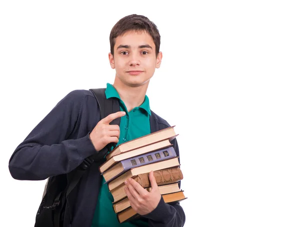 Школьник держит стопку книг, учебник изолирован на белом фоне. Крупный план. — стоковое фото