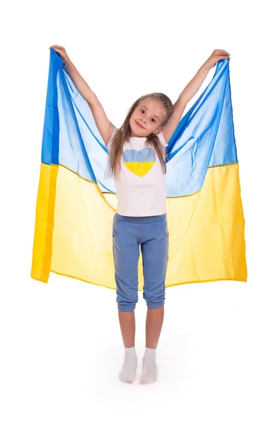 Happy young white girl holding Ukraine flag isolated on a white background. — Stock Photo, Image