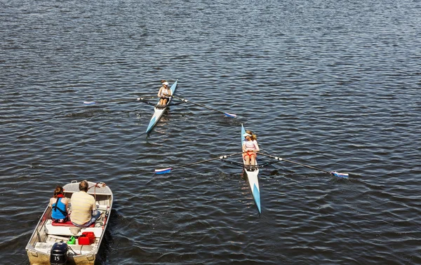 Young female singe scull rowing competitors. — Stock Photo, Image