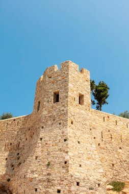 One of the towers of an historic castle on the small island across the bay of Kuadasi, Turkey.