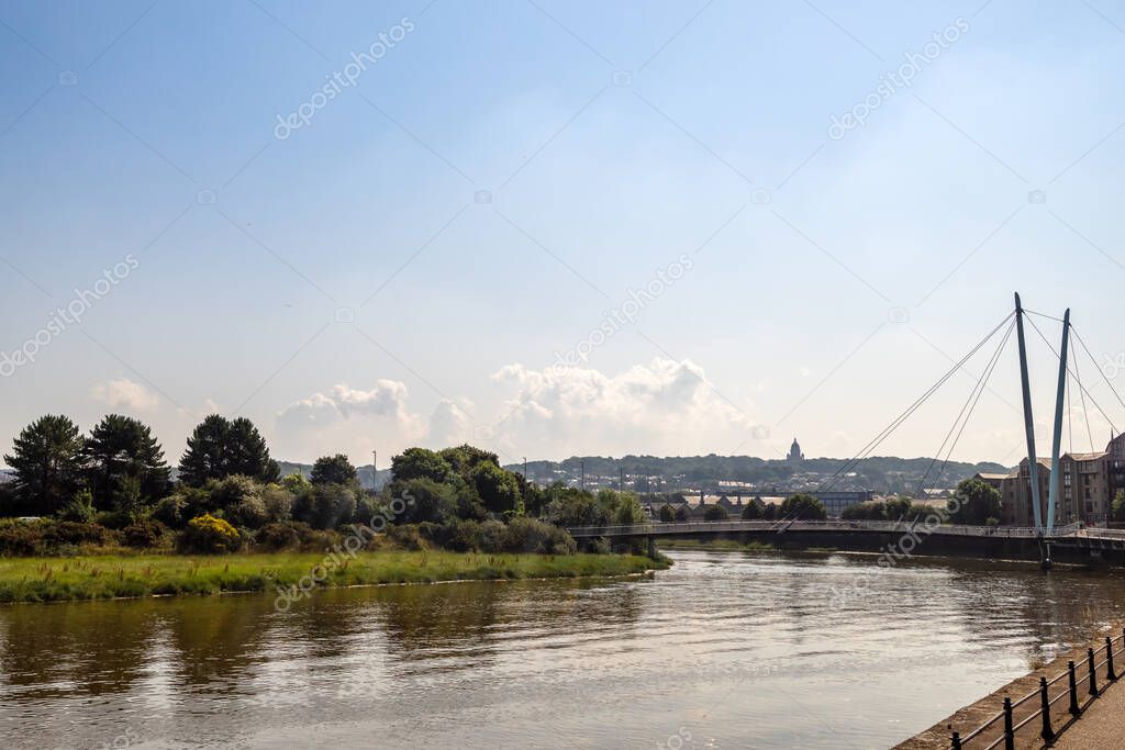 River Lune in Lancaster, UK with cable-stayed the Millennium Bridge in a background.