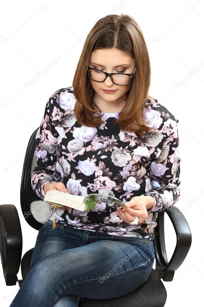 The young woman wearing spectacles reads the book — Stock Photo © Serg+
