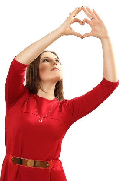 Skuteczne młoda kobieta w czerwonej sukience z czerwonym sercem Valentin — Zdjęcie stockowe