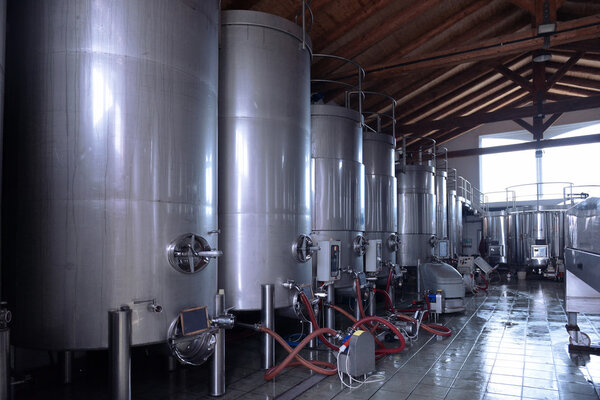 Stainless steel wine vats in a row