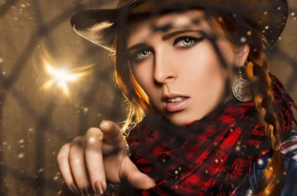 Fantasy portrait of a beautiful girl in a cowboy style looking through Dreamcatcher — Stock Photo, Image