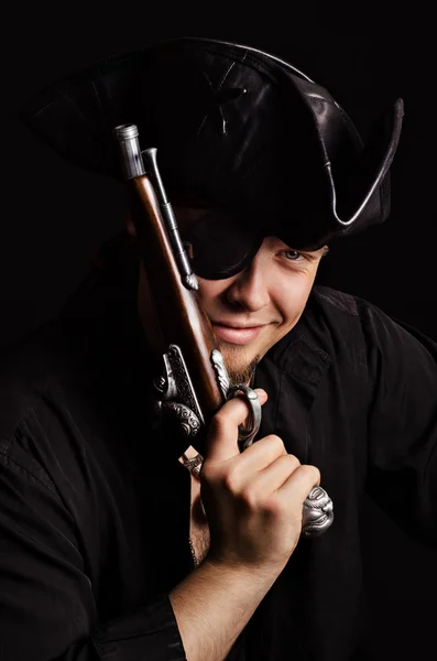 Smiling pirate with ancient pistol