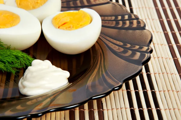 Boiled eggs with mayonnaise and dill — Stock Photo, Image