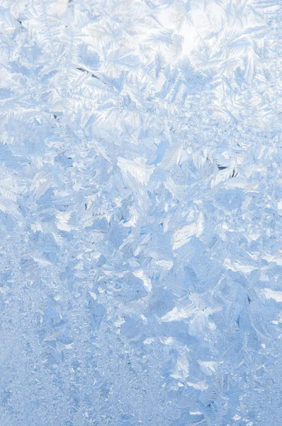 Bakgrund av vackert frostig mönster på glas — Stockfoto