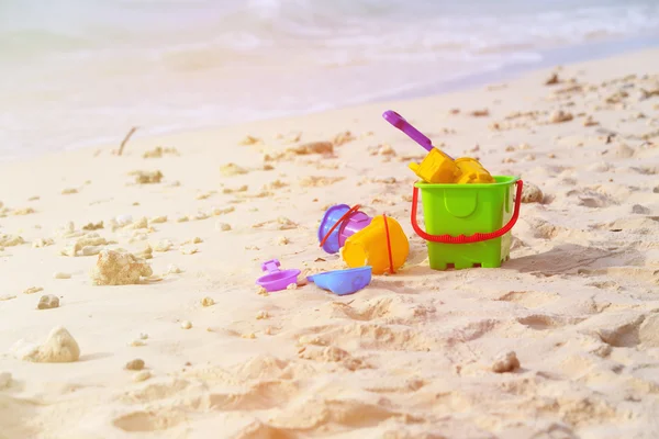 Kids toys on tropical sand beach — Stock Photo, Image