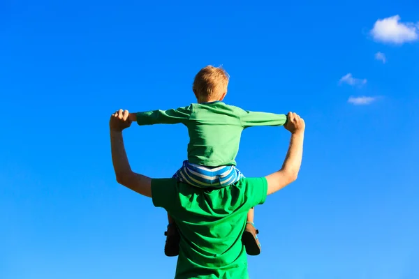 Father and son having fun on sky — Stock Photo, Image