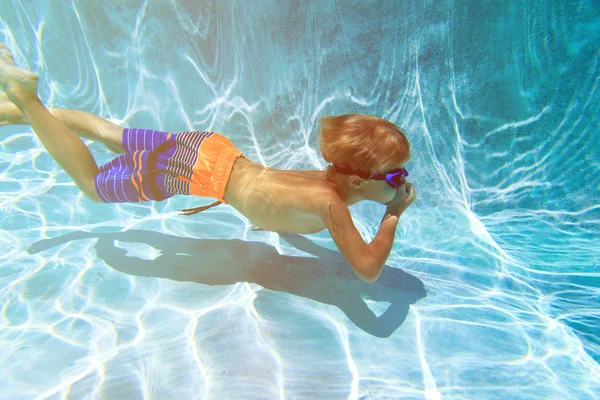 Boy swimming underwater — Stock Photo, Image